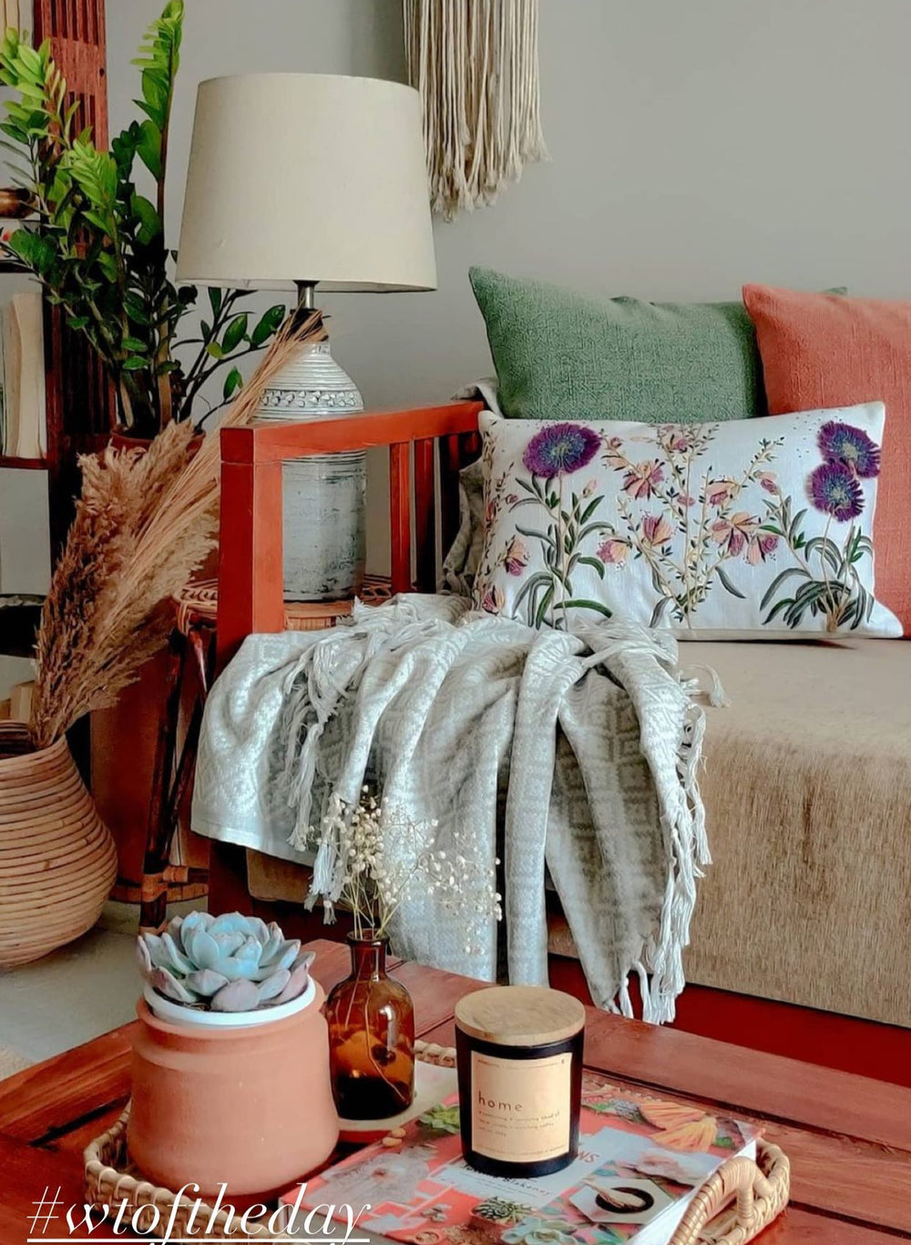 Cozy living room with a couch, lamp, and decorative items.